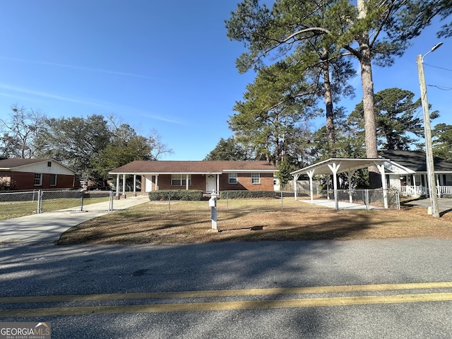 view of front of home featuring a carport