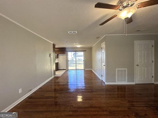 unfurnished room featuring crown molding, ceiling fan, dark hardwood / wood-style floors, and a textured ceiling