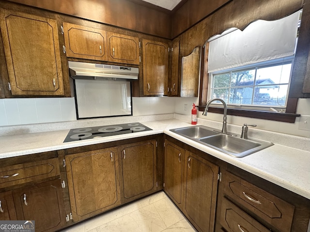 kitchen featuring black electric cooktop and sink