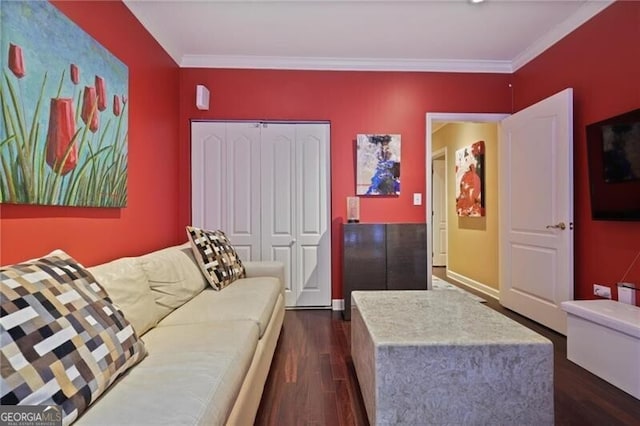 living room with dark hardwood / wood-style flooring and ornamental molding