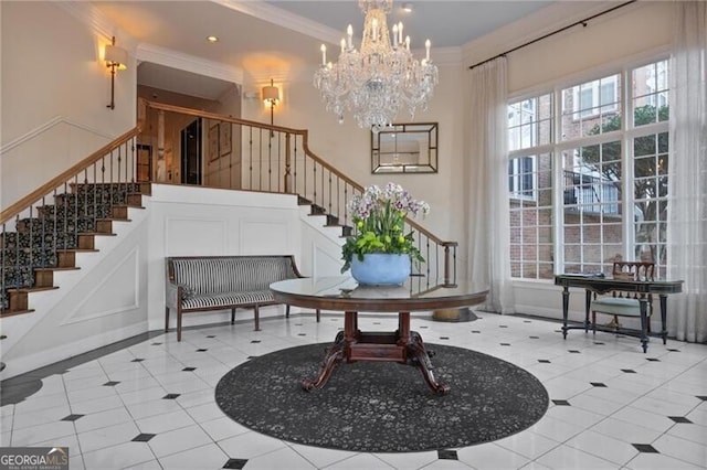 interior space featuring crown molding and a chandelier