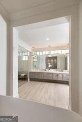 bathroom with hardwood / wood-style flooring