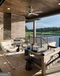 wooden deck featuring ceiling fan and a patio area