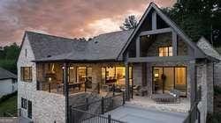 back house at dusk with a patio area