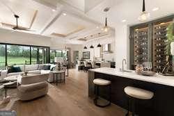 bar featuring wood-type flooring, coffered ceiling, pendant lighting, and beam ceiling