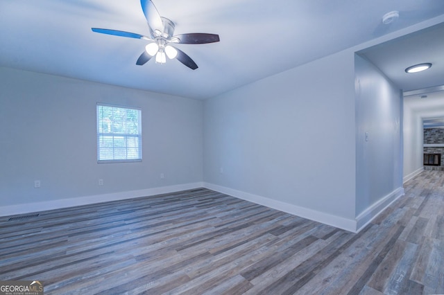 spare room featuring ceiling fan and wood-type flooring