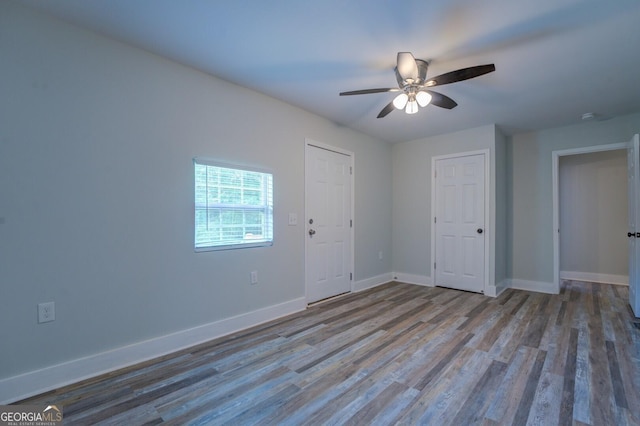 unfurnished bedroom featuring ceiling fan and light hardwood / wood-style flooring