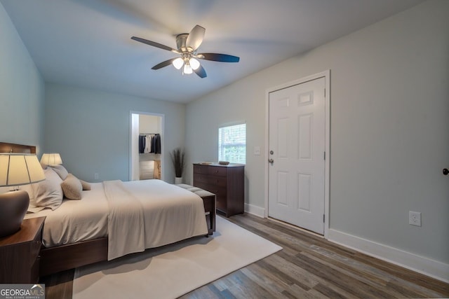 bedroom featuring hardwood / wood-style flooring and ceiling fan