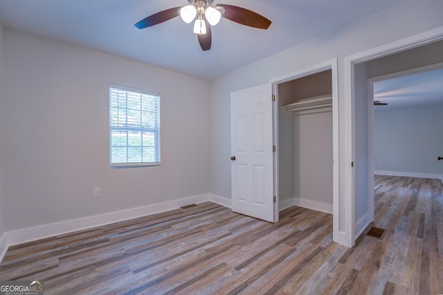 unfurnished bedroom featuring a closet, ceiling fan, and light hardwood / wood-style flooring