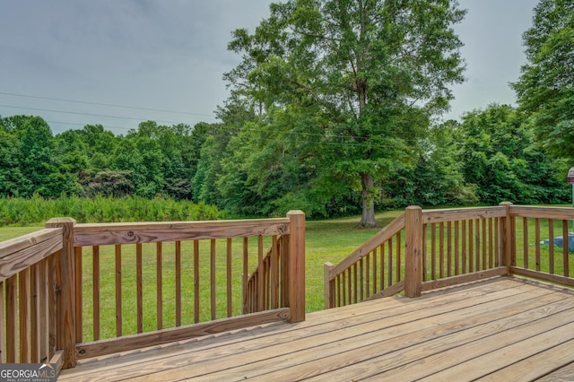 wooden deck with a yard