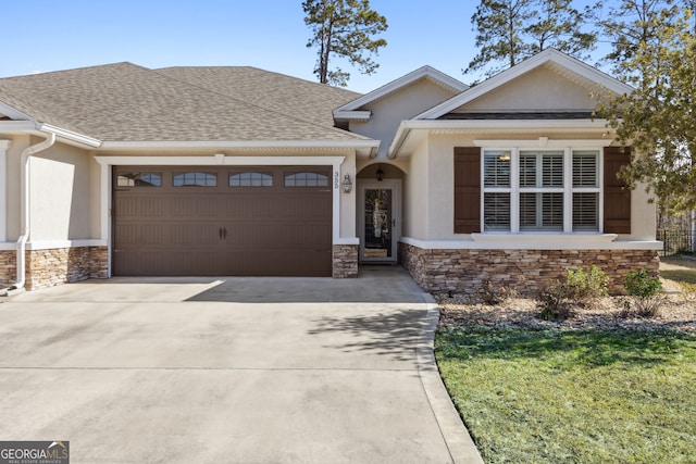 view of front of home with a garage and a front lawn