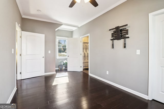 unfurnished room featuring crown molding, dark wood-type flooring, and ceiling fan