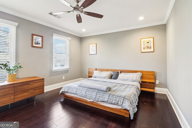 bedroom with ornamental molding, dark hardwood / wood-style floors, and ceiling fan