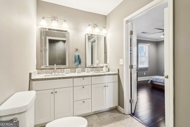 bathroom with vanity, tile patterned floors, ceiling fan, and toilet