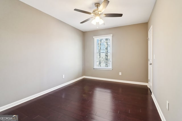 unfurnished room with dark hardwood / wood-style floors and ceiling fan