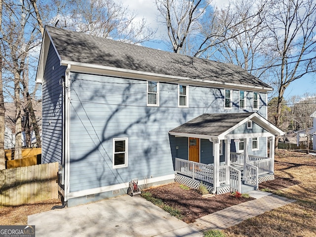 view of front of home featuring covered porch and a patio