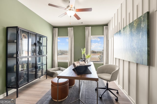 home office featuring ceiling fan and light wood-type flooring