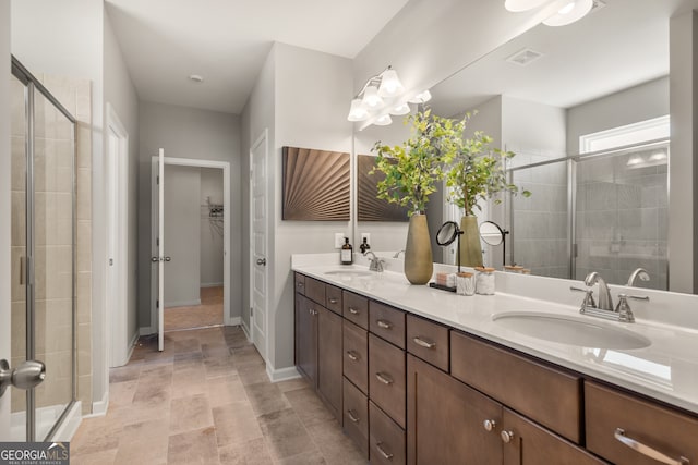 bathroom with vanity and an enclosed shower