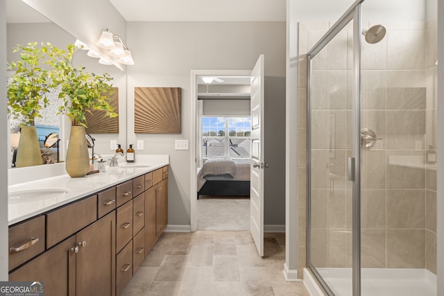 bathroom featuring vanity and an enclosed shower