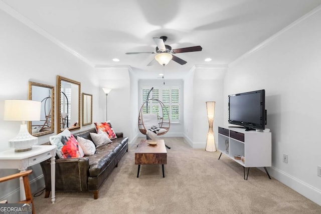 living room featuring light carpet, ornamental molding, and ceiling fan