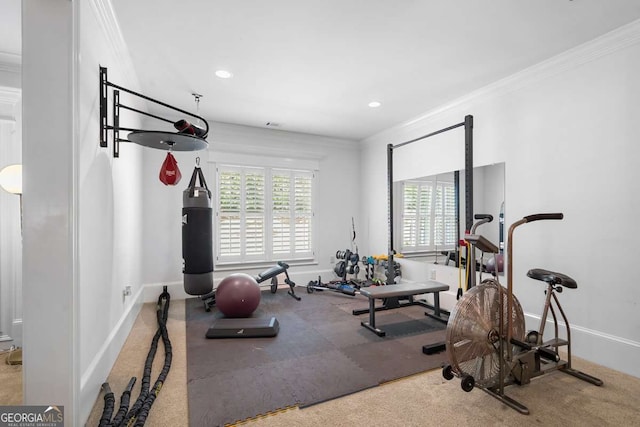 workout area featuring ornamental molding