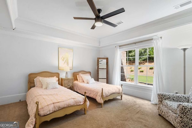 bedroom featuring ornamental molding, ceiling fan, and carpet flooring