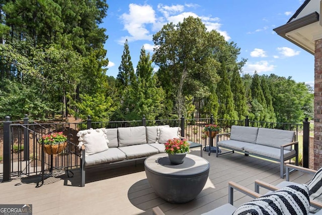 wooden deck featuring an outdoor hangout area