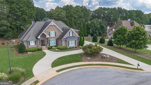 craftsman-style home featuring a front yard