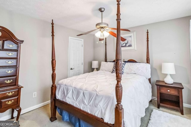 bedroom featuring ceiling fan and light colored carpet