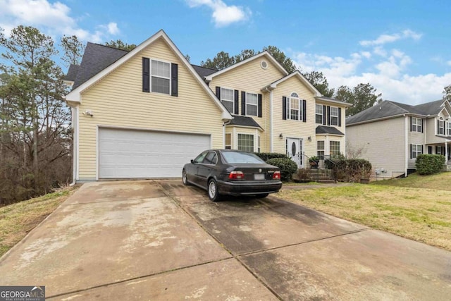 front of property with a garage and a front yard