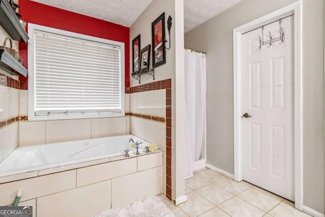 bathroom with tile patterned floors, shower with separate bathtub, and a textured ceiling