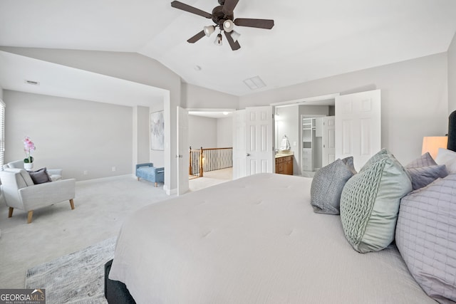 bedroom with lofted ceiling, light colored carpet, visible vents, ceiling fan, and baseboards