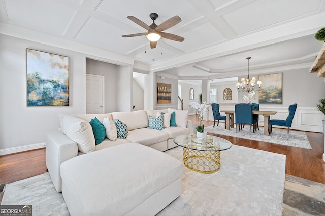 living area featuring coffered ceiling, beamed ceiling, and wood finished floors