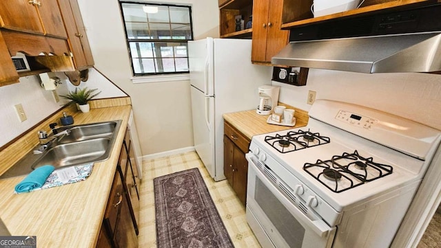 kitchen with white appliances and sink