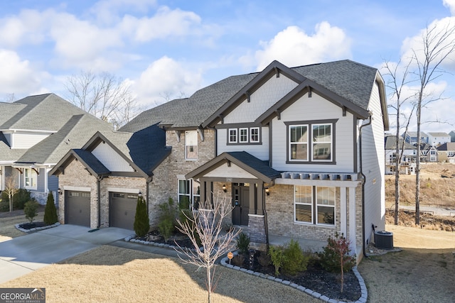 view of front of house featuring central AC unit, a garage, and a porch