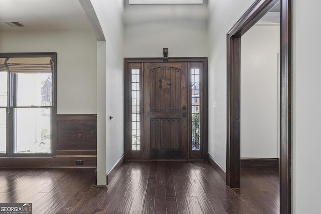 foyer entrance with dark hardwood / wood-style floors