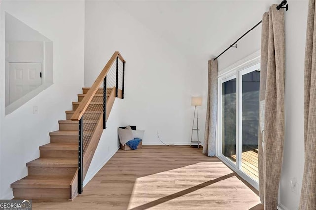 staircase featuring hardwood / wood-style flooring