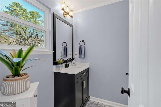 bathroom featuring crown molding and vanity