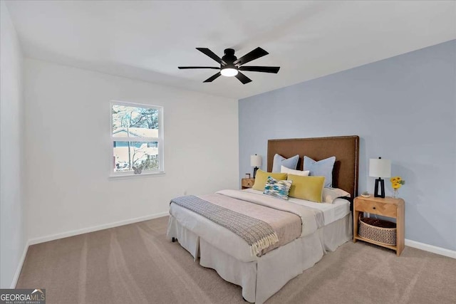 bedroom with ceiling fan and carpet floors