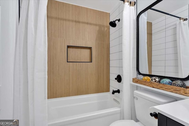 full bathroom featuring shower / bath combo, vanity, and toilet