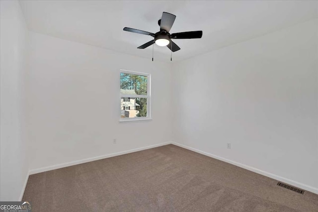 carpeted empty room with ceiling fan