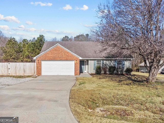 single story home with a garage and a front lawn