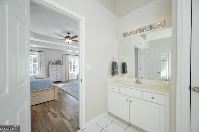 bathroom featuring hardwood / wood-style flooring, vanity, and ceiling fan