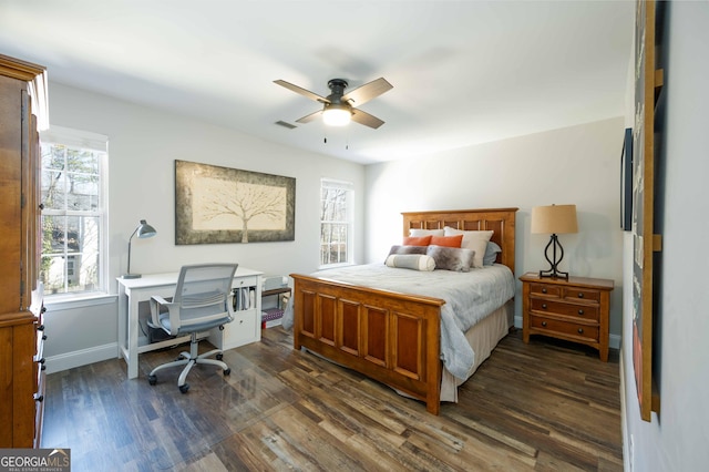 bedroom with dark wood-type flooring and ceiling fan