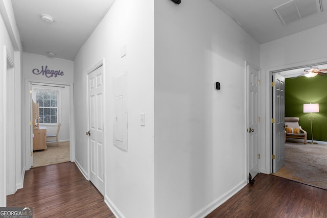 hall with dark hardwood / wood-style floors