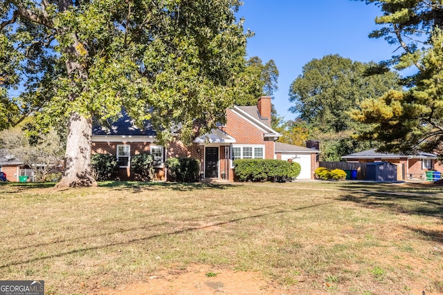 obstructed view of property featuring a front yard