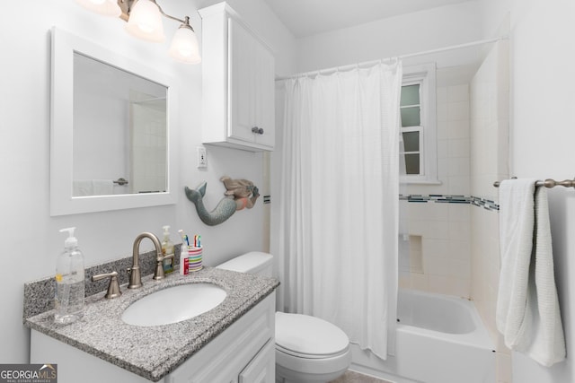 full bathroom featuring vanity, shower / bath combo with shower curtain, and toilet