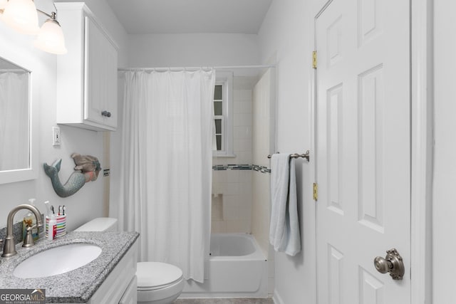 full bathroom with vanity, shower / bath combo with shower curtain, and toilet