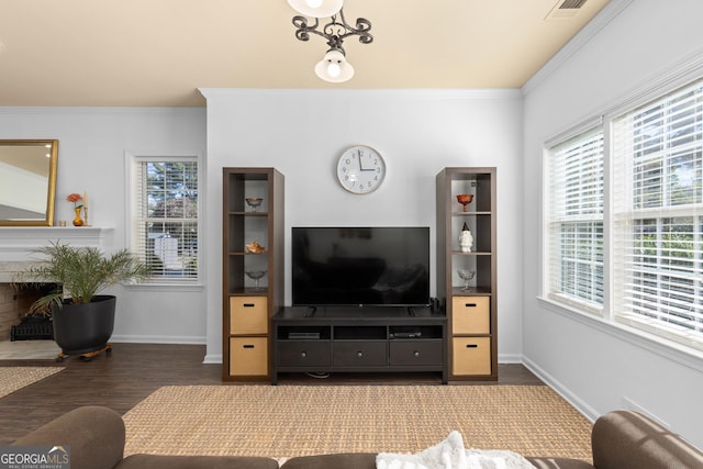 living room featuring ornamental molding and dark hardwood / wood-style floors