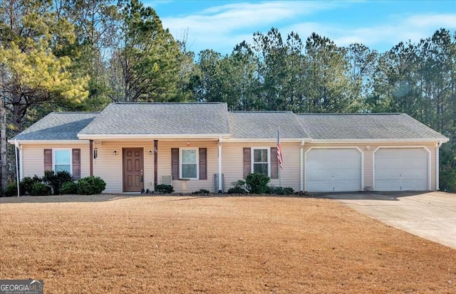 single story home with a garage and a front yard